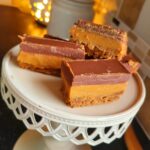 My Biscoff Millionaire Bars recipe, is so popular and easy to make. Its just sweet enough, and delicious served with freshly whipped cream, or warm with ice cream. 